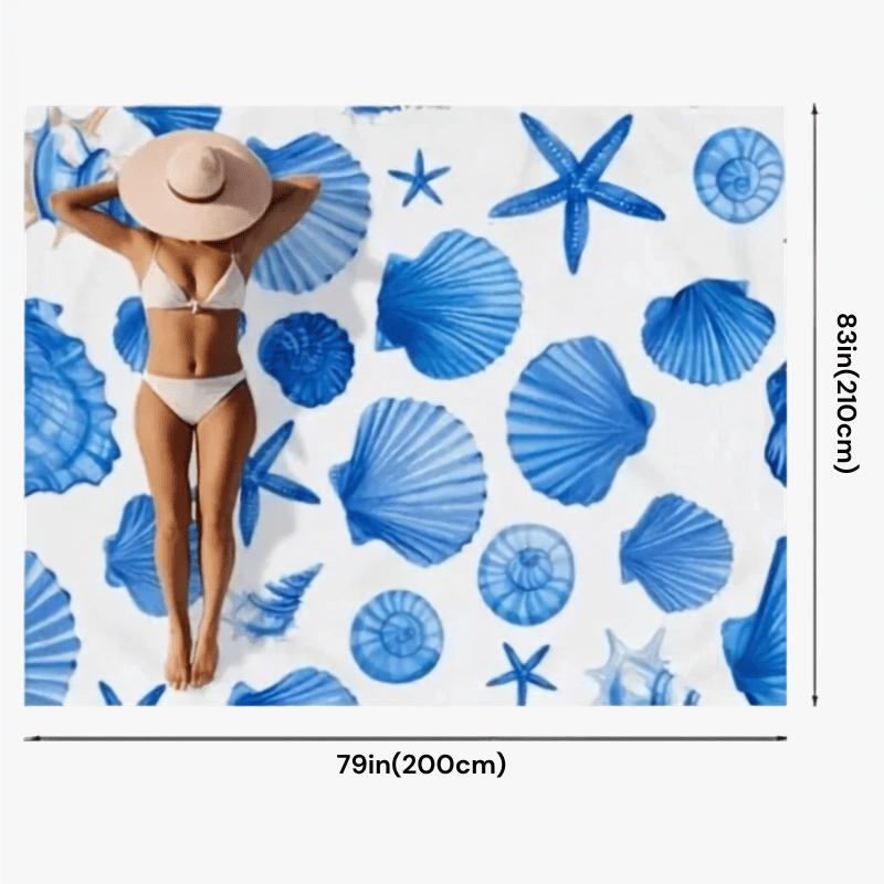 Portable Beach Mat – Sandproof Waterproof Camping & Picnic Blanket A beach-themed print featuring blue seashells and starfish on a white background, shown with dimension markers indicating 79 inches by 83 inches (200 cm by 210 cm). A woman in a white bikini and beige sun hat is printed on the surface.