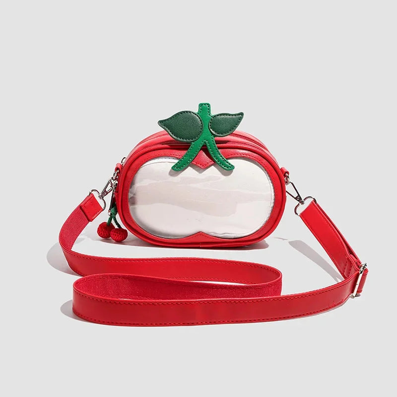 Apple-Shaped Crossbody Phone Purse – Lightweight Shoulder Bag A red apple-shaped crossbody bag with a clear front window, green leaf and stem details, and a matching red shoulder strap, shown on a light gray background.