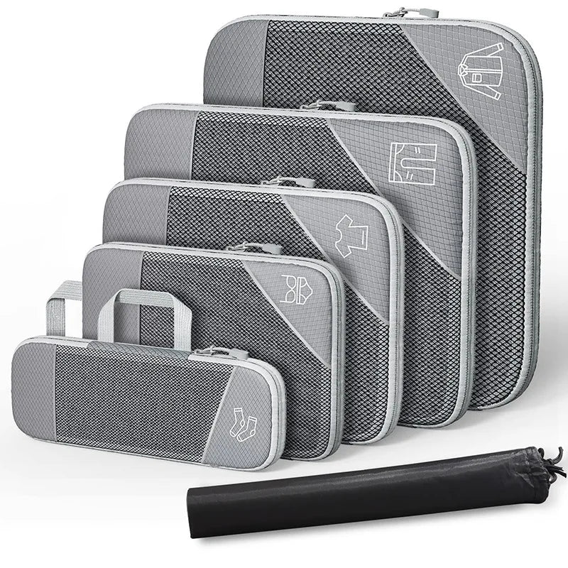 Compression Packing Cubes Set with Shoe Bag – Travel Luggage Organizers Set of gray packing cubes with a black compression bag on a white background