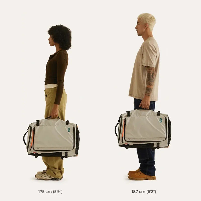 Wheeled Travel Backpack – Large Capacity Carry-On Two people holding large bags, with measurements indicated on a plain background