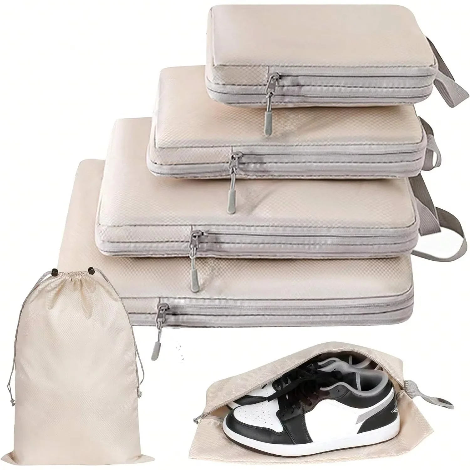 Compression Packing Cubes Set – Space-Saving Luggage Organizers Set of beige and gray packing cubes with a shoe bag on a white background