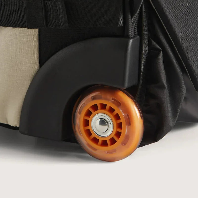 Wheeled Travel Backpack – Large Capacity Carry-On Close-up of a suitcase wheel on a light gray background