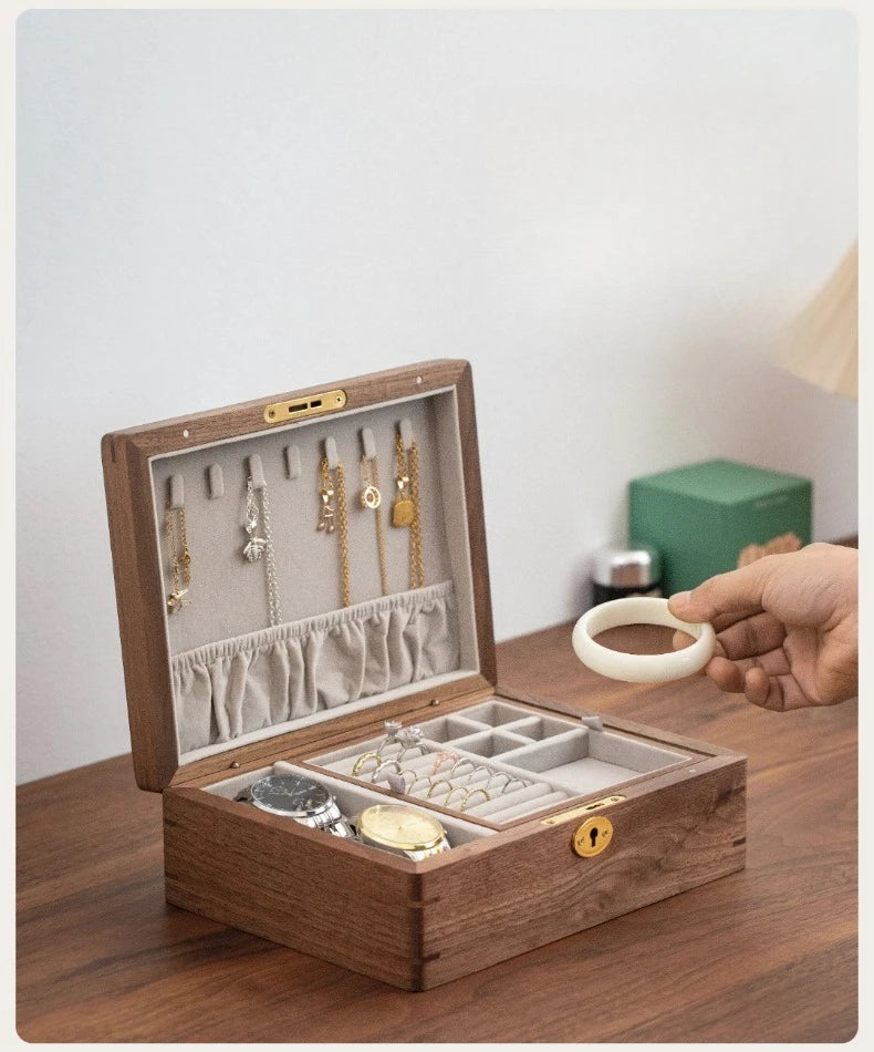 Solid Wood Travel Jewelry Box with Lock – Portable Jewelry Organizer Wooden jewelry box with jewelry items on a wooden table