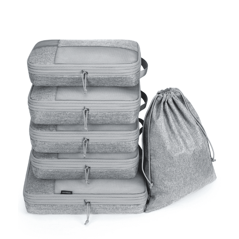 Compression Packing Cubes for Travel – Expandable Luggage Organizers A set of five gray zippered packing cubes stacked vertically next to a matching gray drawstring bag, shown on a clean white background.