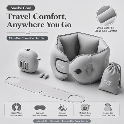 Smoke gray all-in-one travel comfort set featuring a cloud-like inflatable neck pillow, a matching eye mask, earplugs, an inflatable storage bag, and a small charging case, shown on a clean light gray background with marketing text and feature icons.