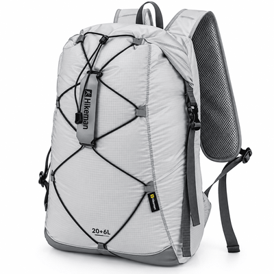 A light gray and dark gray hiking backpack with black compression straps and a mesh back panel, shown on a white background.