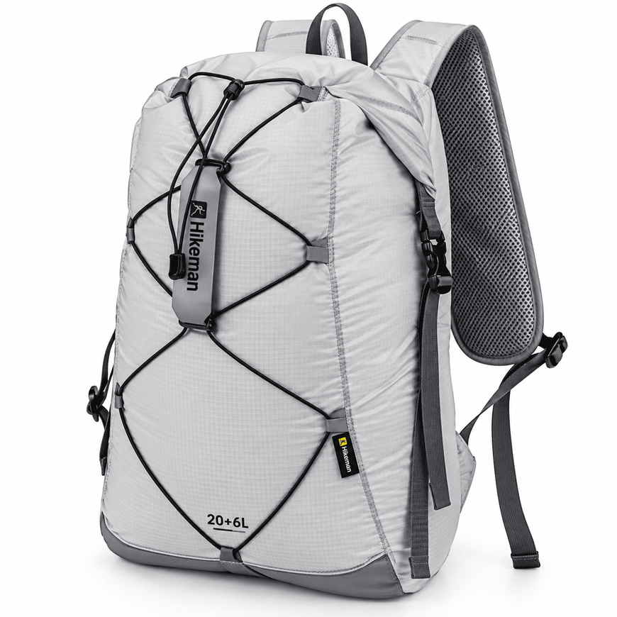 A light gray and dark gray hiking backpack with black compression straps and a mesh back panel, shown on a white background.