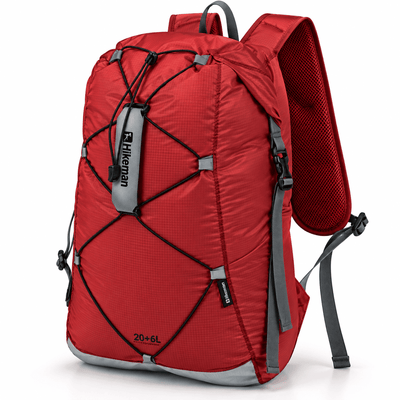 A red 20+6L hiking backpack with gray straps and black compression cords, shown on a clean white background.