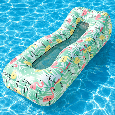 An inflatable pool float with a tropical flamingo print, floating on clear blue swimming pool water.