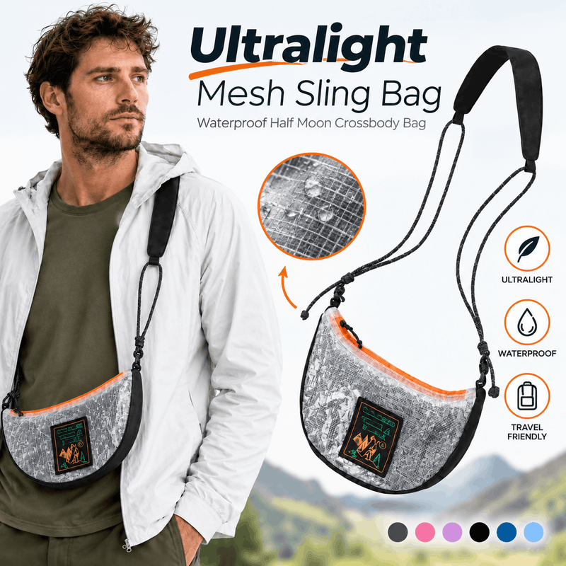 A crescent-shaped shoulder bag with a silver and black camouflage pattern, black trim, a black adjustable strap, and a bright orange zipper. A green and yellow 'OGE GEAR TRAVEL & HIKE' patch is attached to the front.