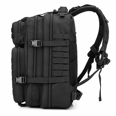 A black tactical backpack with multiple zippered compartments, MOLLE webbing, and padded shoulder straps, shown from a three-quarter angle on a white background.