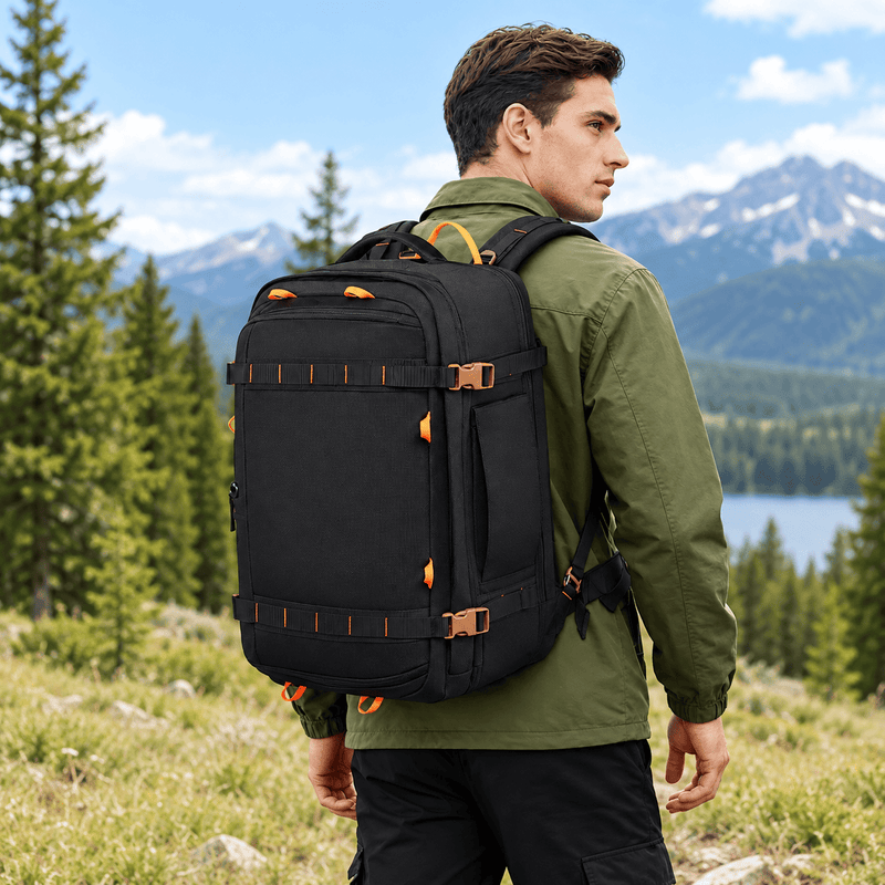 A beige tactical backpack with black straps and trim, featuring orange accent loops and zippers, shown on a plain white background.