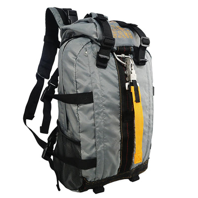 Gray backpack with black straps and a yellow zipper on a white background