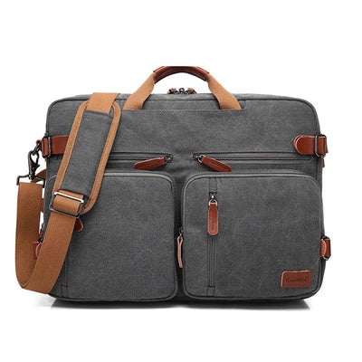 A dark gray canvas laptop bag with tan leather handles, zippers, and straps, shown on a white background with '17inch' and 'Material: CANVAS' text overlays.
