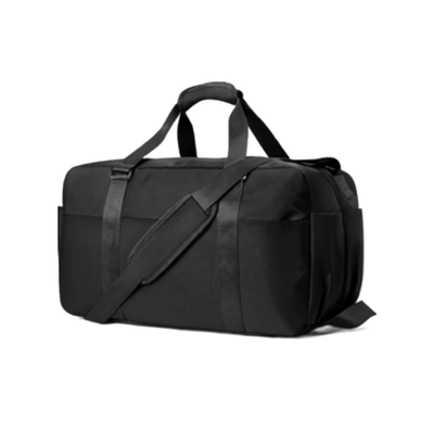 A black nylon duffel bag with dual top handles and a detachable shoulder strap, shown from a three-quarters angle on a plain white background.