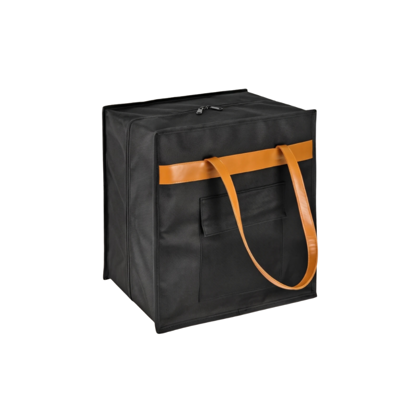 A black soft-sided cube storage bag with two tan shoulder straps and a matching tan horizontal accent stripe, shown on a plain white background.