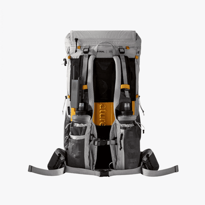 A technical outdoor backpack shown from the back, featuring a gray and black design with bright orange accents and integrated water bottles, photographed against a solid white background.