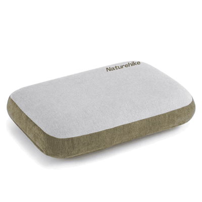 A rectangular travel pillow by Naturehike with a light gray top surface and an olive green fabric side and bottom edge, shown on a clean white background.