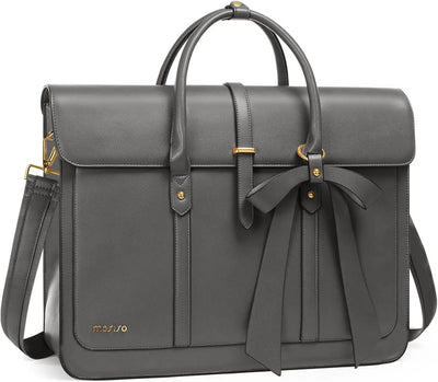 Gray leather bag with a bow detail on a white background