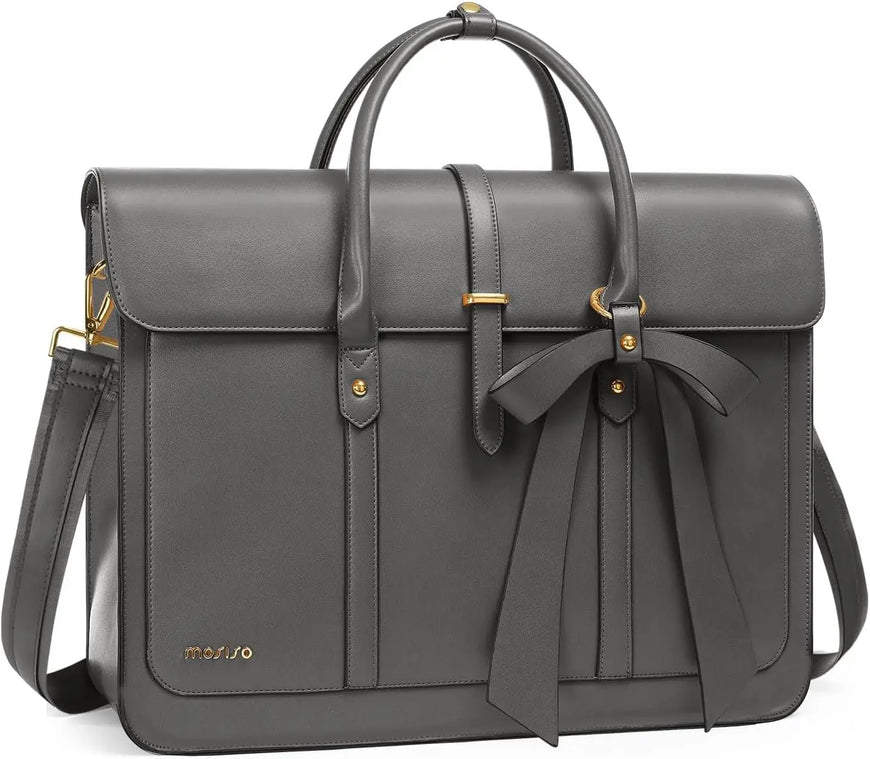 Gray leather bag with a bow detail on a white background