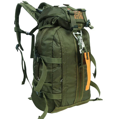 Green backpack with multiple straps and a white background