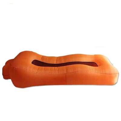 Orange inflatable pillow with carrying bag and dimensions on a white background, featuring the brand 'Otautau'.
