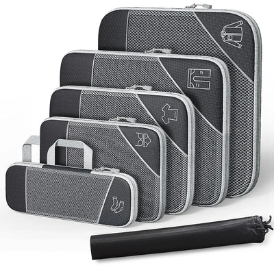 Set of gray packing cubes with zippers on a white background