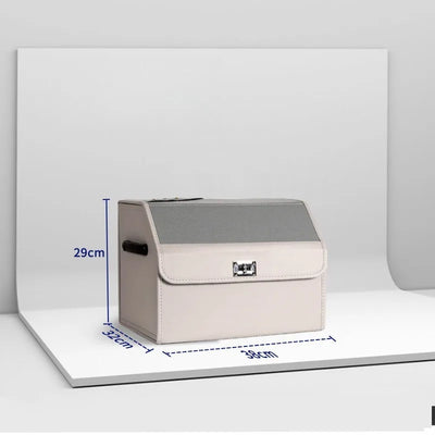 A beige and gray storage box with a hinged lid and metal clasp, shown on a white display stand with blue dimension lines indicating 29cm height, 32cm width, and 39cm depth.