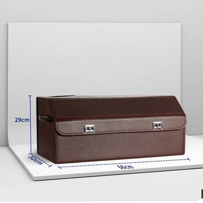 A brown rectangular storage box or case with a front flap and silver metal latch hardware, shown on a white display board with blue dimension lines indicating 29 cm height, 30 cm width, and 66 cm length.