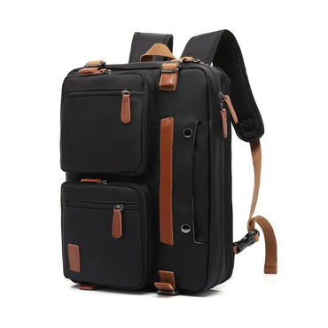 A black nylon backpack with brown faux-leather accents, shown on a clean white background. The backpack features multiple zippered compartments, a vertical brown handle, and adjustable shoulder straps.