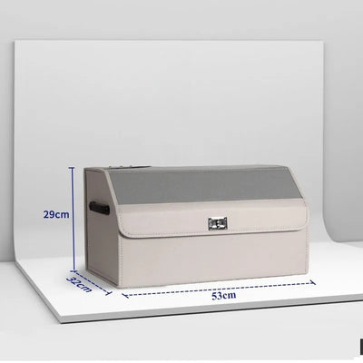 A beige and gray storage trunk with dimension markings showing 53cm length, 29cm height, and 32cm width, displayed on a white background.