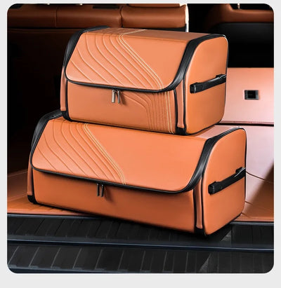 Two tan-orange car trunk organizer bags with black trim, stacked inside a car trunk.