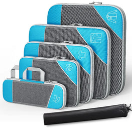 Set of gray and blue packing cubes with a black compression bag on a white background