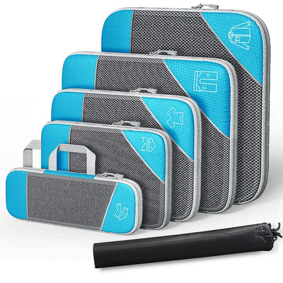 Set of gray and blue packing cubes with a black compression bag on a white background