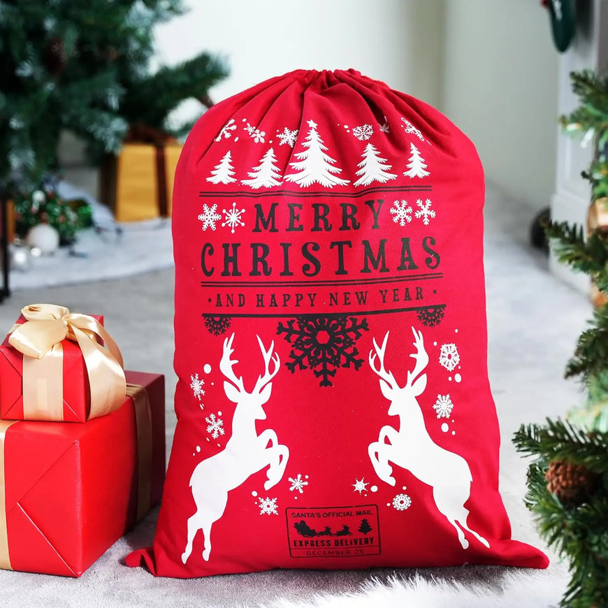 Red Christmas sack with reindeer and text, surrounded by presents and a tree.