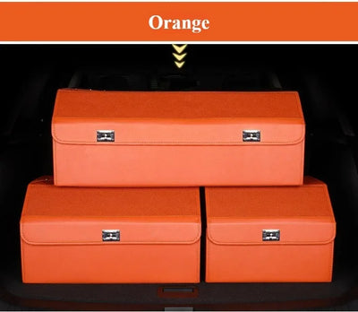 Three orange storage boxes stacked inside a car trunk, with an orange banner at the top labeled 'Orange'.