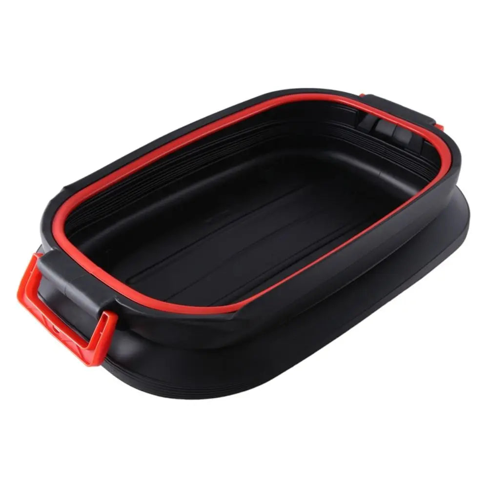 A black collapsible silicone container with a red inner rim and red latch handles, shown on a plain white background.