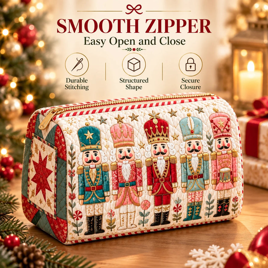 A quilted zippered cosmetic pouch decorated with embroidered nutcracker figures and holiday patchwork details, shown on a wooden surface with a blurred Christmas tree and ornaments in the background. Text at the top highlights a smooth zipper and key features.