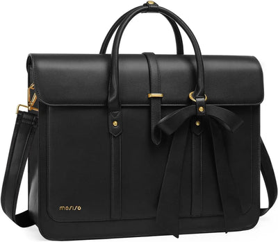 Black leather bag with a bow and gold accents on a white background