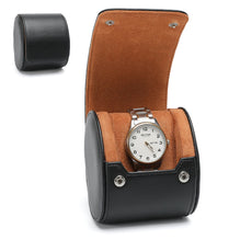 Watch in a black and brown display case on a white background