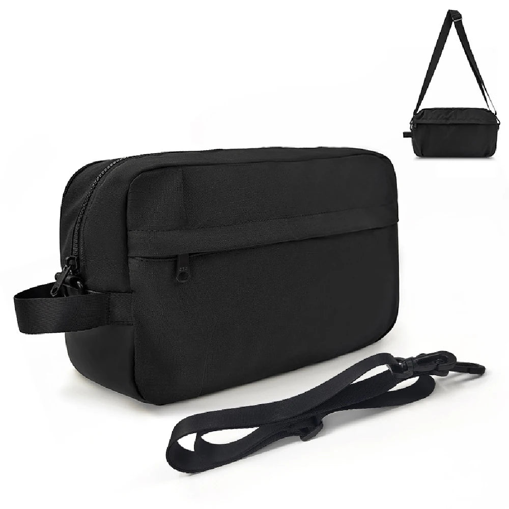 A black nylon crossbody bag with a zippered front pocket and an adjustable shoulder strap, shown on a white background with a small inset demonstrating the strap opening.