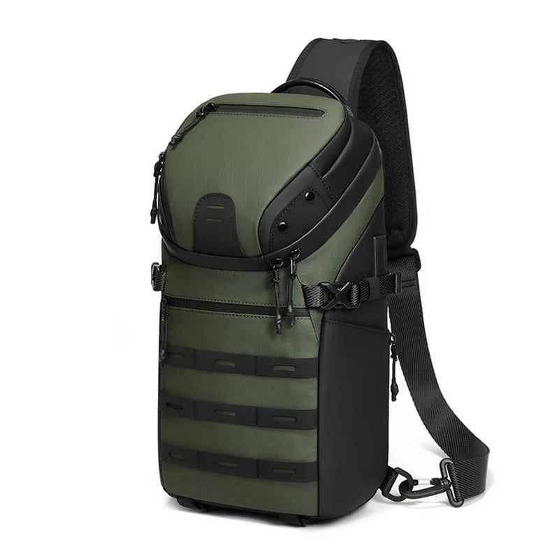 An olive green tactical sling backpack with black accents, shown on a plain white background.