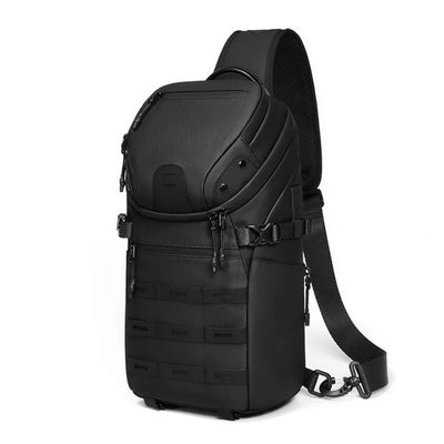 A black tactical sling backpack with multiple zippered compartments, webbing straps, and an adjustable shoulder strap, shown on a solid white background.