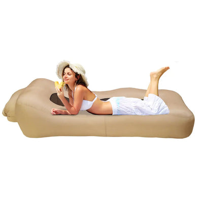 Woman lying on a beige inflatable sofa with Otautau logo, close-up of product in corner.
