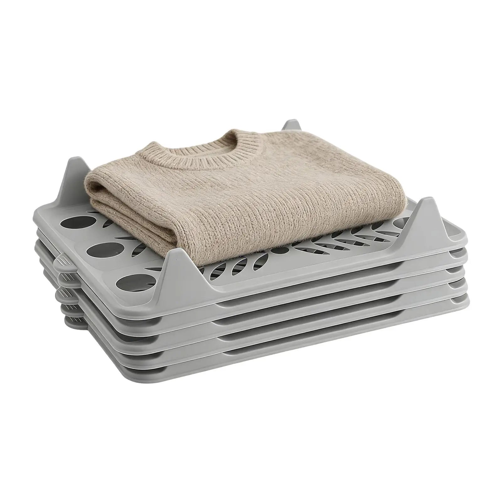 A stack of gray plastic collapsible garment racks with a folded beige knit sweater placed on top, shown on a plain white background.