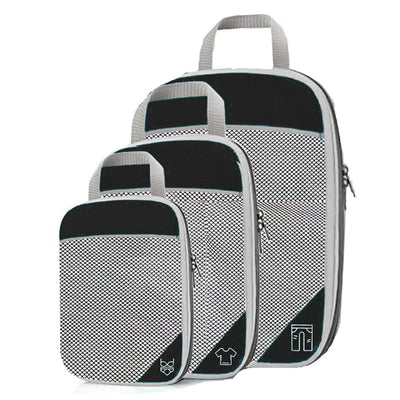 Set of three gray packing cubes with black accents on a white background