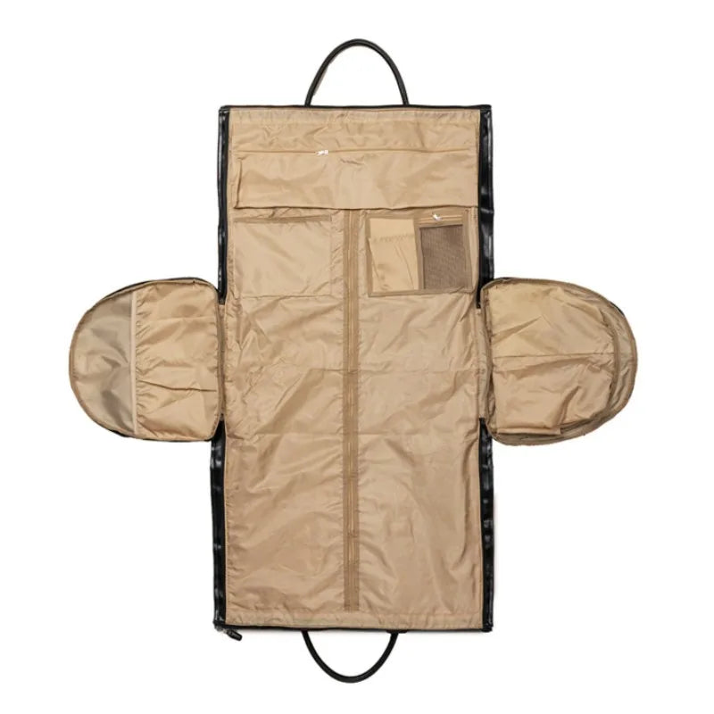Gray duffel bag with brown leather straps on a white background