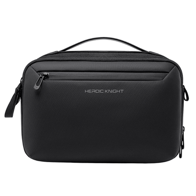 A black textured zippered travel pouch with a top handle and the brand name 'HEROIC KNIGHT' printed in white on the front, set against a plain white background.