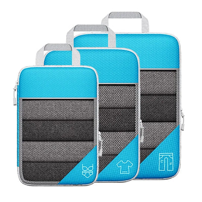 Set of three blue and gray packing cubes on a white background