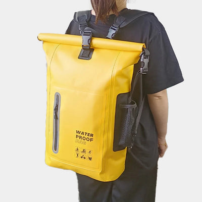 Person wearing a yellow waterproof backpack on a plain background